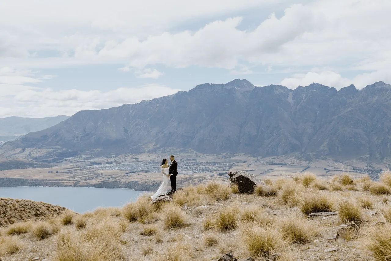 A photo of a couple getting married in Queenstown New Zealand by Tasmanian wedding celebrant Josh Withers photographed by George Bowden for the Elopement Collective ⌘