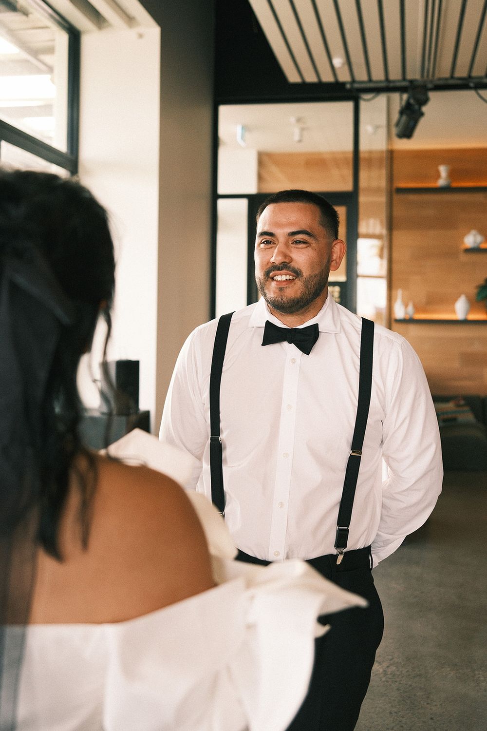 Mickey smiling at Deb during their wedding ceremony