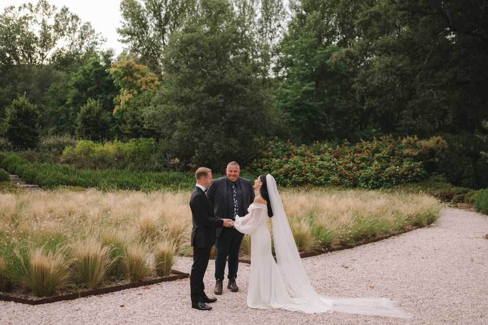 Josh and Harry waiting in the Vocabolo Moscatelli gardens before the ceremony