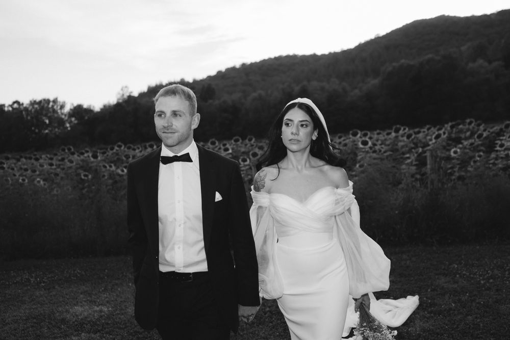 Harry and Nayla standing together in the greenery at Vocabolo Moscatelli