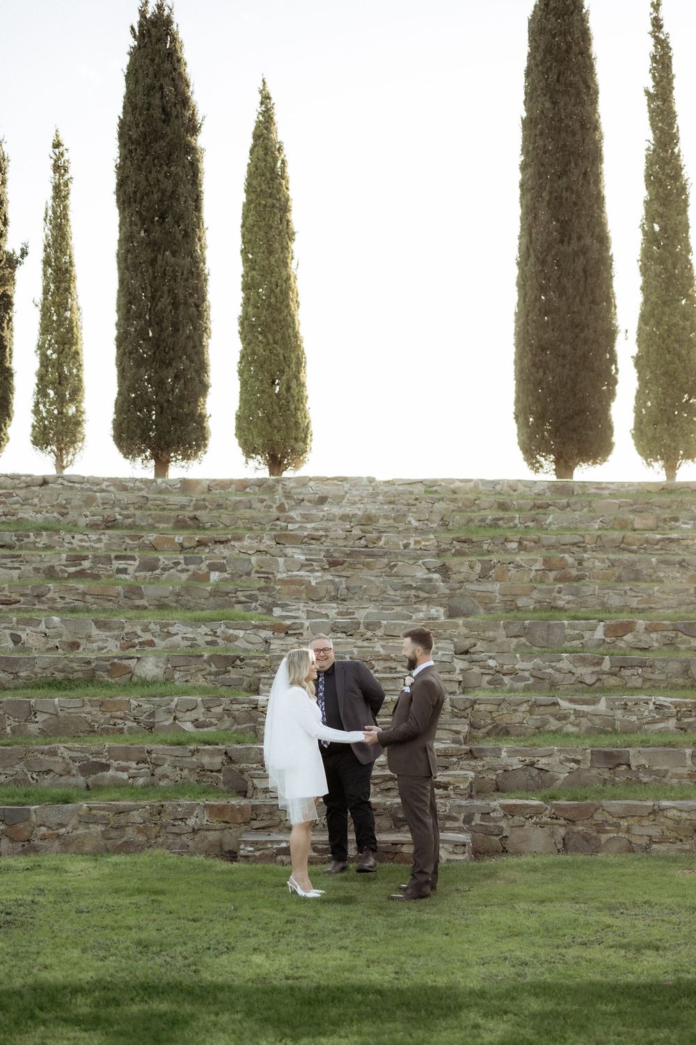 Josh Withers leading Kaitlyn and Russell’s elopement ceremony beneath the cypress trees
