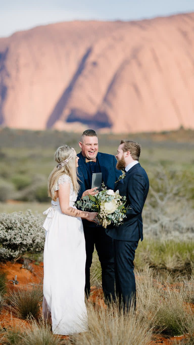 Josh Withers conducting a ceremony at Uluru