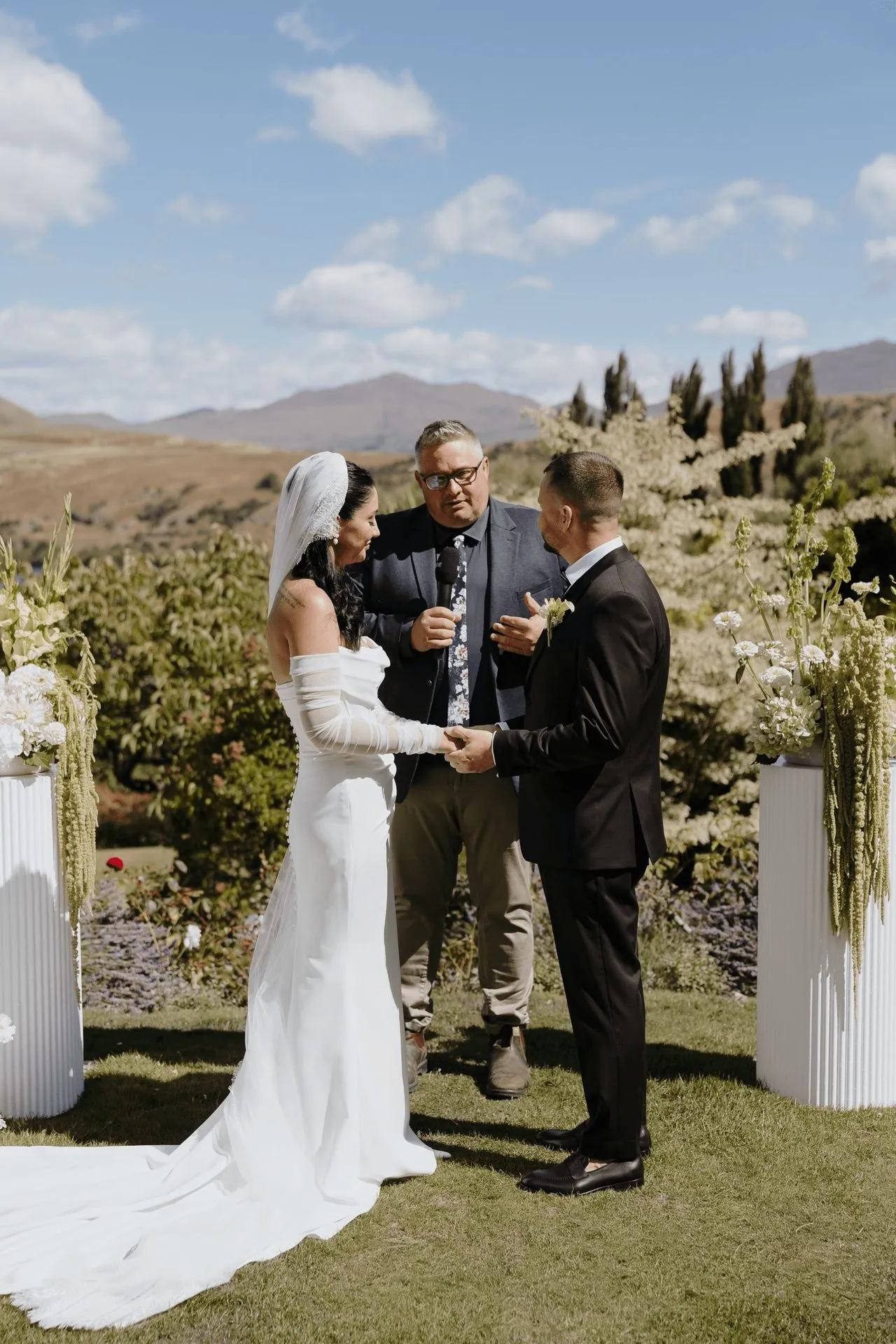 A photo of a couple getting married at a wedding venue in Queenstown New Zealand with the best wedding celebrant Josh Withers who flew to New Zealand for their wedding from Hobart Tasmania photographed by George Bowden ⌘
